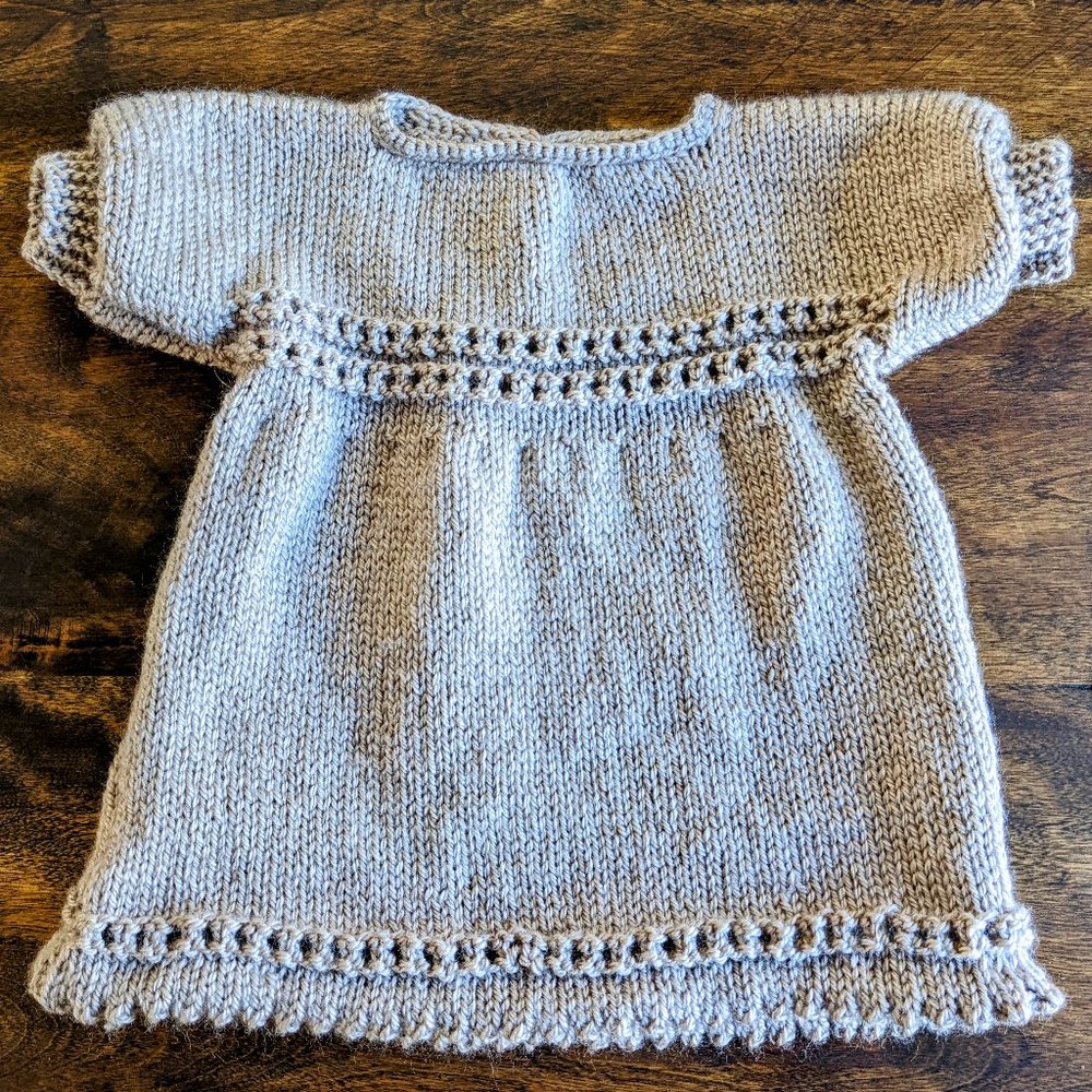 Hand knitted taupe, brown baby girl dress